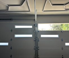 Sectional garage door with window panels, interior view